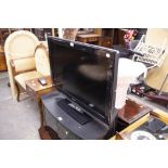 A SHARP 32" FLAT SCREEN TELEVISION