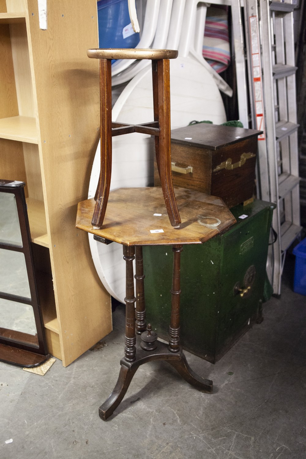 AN OCTAGONAL OCCASIONAL TABLE, ON THREE TURNED SUPPORTS AND OUTSWEPT LEGS, A SMALL CIRCULAR INLAID