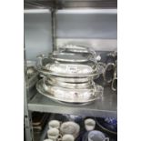 A SET OF FOUR ELECTROPLATE LARGE OVAL ENTRÉE DISHES AND TWO HANDLED COVERS, 12" LONG