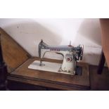 JONES ELECTRIC SEWING MACHINE IN OAK DROP HEAD CABINET