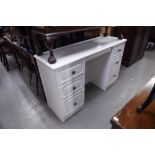 A MODERN WHITE PAINTED WOOD DOUBLE PEDESTAL DRESSING TABLE OF SIX DRAWERS