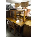 A 1950's WALNUTWOOD DINING ROOM SUITE OF SIX PIECES, VIZ FOUR CHAIRS, A DRAW-LEAF TABLE AN