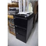 A METAL THREE DRAWER FILING CABINET