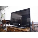 TOSHIBA FLAT SCREEN TELEVISION WITH REMOTE AND A DVD PLAYER