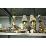 THREE GILT METAL FIGURAL CANDLESTICKS, TWO FLORAL TABLE LIGHTS, SIMILAR CEILING LIGHT AND TWO OTHERS