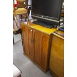 A WALNUTWOOD TWO DOOR TV CABINET AND TWO VIDEO RECORDERS