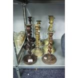 FOUR PAIRS OF BRASS AND WOODEN CANDLESTICKS