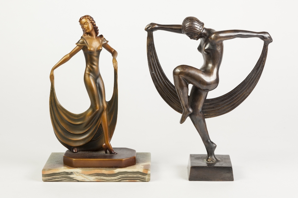 ART DECO DESIGN BRONZE AND GREEN PATINATED METAL FIGURE OF A FEMALE DANCING, the hem of her skirts