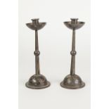 PAIR OF W.M.F., GERMANY, PLATED METAL ARTS AND CRAFTS DESIGN CANDLESTICKS, with dished circular drop