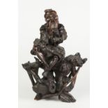 NINETEENTH CENTURY CHINESE ROOT WOOD CARVING, in the form of a bearded man sat on a tree root,