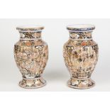 A PAIR OF JAPANESE MEIJI PERIOD IMARI STYLE PORCELAIN VASES, the ribbed ovoid bodies rising from