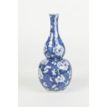 CHINESE BLUE AND WHITE PORCELAIN VASE, of double gourd form painted with prunus on a cracked ice