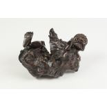 NINETEENTH CENTURY CHINESE ROOT CARVING of a bearded man seated, 7" (17.8cm) high (incomplete and