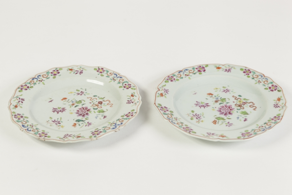 PAIR OF CHINESE FAMILLE ROSE PORCELAIN SIDE PLATES, each of typical form with cyma border, painted