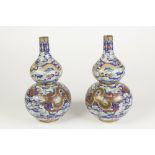 A PAIR OF GOOD QUALITY LATE QING DYNASTY CLOISONNE DOUBLE GOURD SHAPE VASES, each worked to the