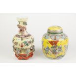 CHINESE PORCELAIN YELLOW GROUND BOTTLE SHAPED VASE, supported on the integral hexagonal base by