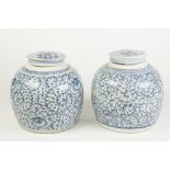 A PAIR OF LATE NINETEENTH/EARLY TWENTIETH CENTURY CHINESE PORCELAIN COVERED JARS, painted in