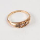 VICTORIAN 18ct GOLD RING, the lozenge shaped top set with a centre seed pearl flanked by two tiers