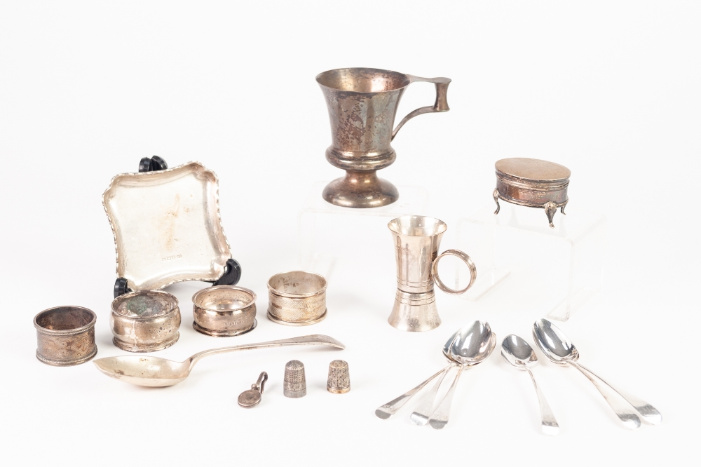 A SILVER CHRISTENING MUG, London 1912, a SILVER MEASURE, a silver pin tray, A SILVER DRESSING