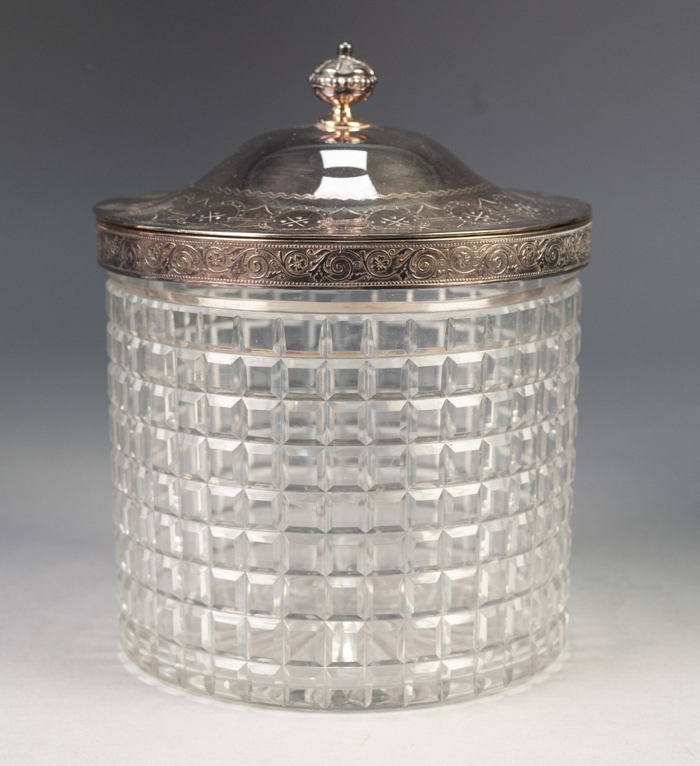 AN EDWARDIAN CUT GLASS BISCUIT BARREL with electroplated cover and rim mount