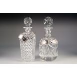 TWO GOOD QUALITY CUT GLASS DECANTERS with two modern SILVER WINE LABELS, and two metal ditto