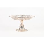 EDWARDIAN SILVER CIRCULAR PEDESTAL CAKE STAND, the top with cut card pierced broad sloping border