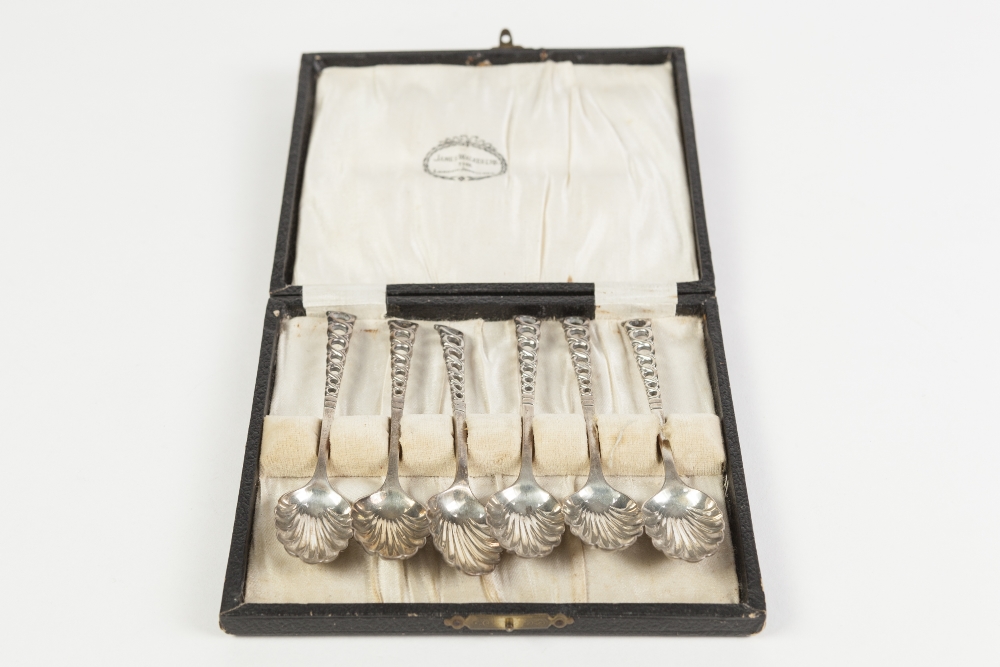 A LATER CASED SET OF SIX VICTORIAN SILVER TEASPOONS, with openwork handles and scallop bowls,