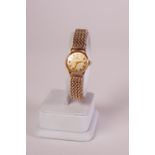 9ct GOLD CASED LADY'S OMEGA WRIST WATCH, on 9ct gold 'Chaincraft' linked bracelet, 31.1gms gross