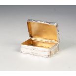 SILVER SNUFF BOX, oblong with shaped outline and sides, the hinged lid having engine turned