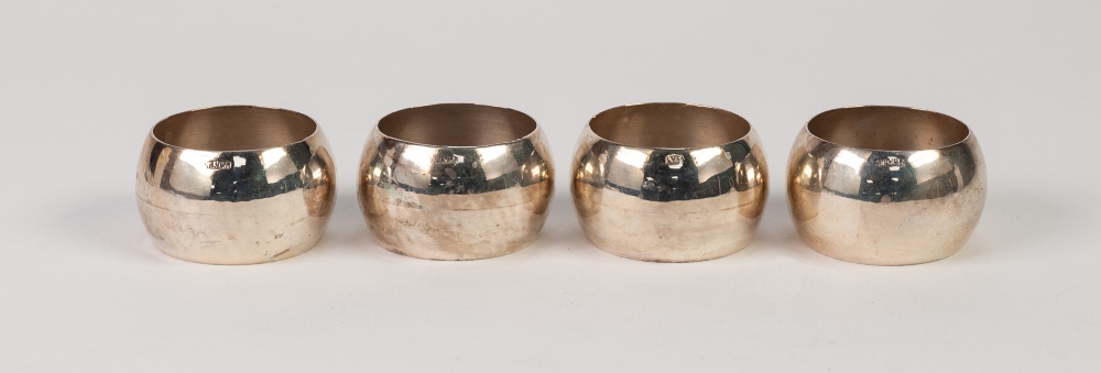 SET OF FOUR PROBABLY ORIENTAL, PLAIN SILVER COLOURED METAL CIRCULAR NAPKIN RINGS (stamped '