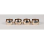 SET OF FOUR PROBABLY ORIENTAL, PLAIN SILVER COLOURED METAL CIRCULAR NAPKIN RINGS (stamped '