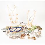 A QUANTITY OF COSTUME JEWELLERY mainly brooches and necklaces