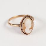9ct GOLD RING, collet set with an oval shell cameo carved with a female head, 2.6gms