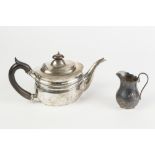 AN EARLY TWENTIETH CENTURY SILVER BACHELOR TEAPOT, of oval form with blackwood scroll handle and