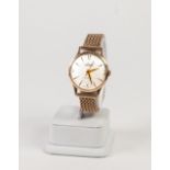 GENTS ACCURIST 9ct GOLD WRIST WATCH, with 21 jewels movement, circular silvered dial with batons and