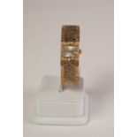 9ct GOLD CASED LADY'S MAJEX 21 JEWELS INCABLOC WRIST WATCH, on integral bi-colour gold bark textured