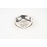 SILVER COLOURED METAL CIRCULAR DISH, the centre repousse with a sunburst motif, 4 3/4" diameter, '