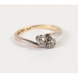 18ct GOLD AND PLATINUM CROSS OVER RING, set with two old cut diamonds in deceptive settings,