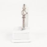 LADY'S GIRARD-PERREGAUX SWISS 18ct WHITE GOLD AND DIAMOND BRACELET WATCH, with mechanical