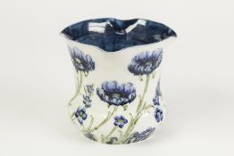 A CIRCA 1900 JAMES MACINTYRE AND CO., POTTERY FLORIAN WARE PLANT HOLDER, designed by William