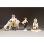 THREE HEREND, HUNGARIAN HAND PAINTED PORCELAIN FIGURES, comprising: BOY WITH GOAT FEEDING FROM A