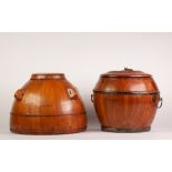 TWO CHINESE PINE WOOD RICE CONTAINERS AND COVERS, one brass mounted and with two handles, the