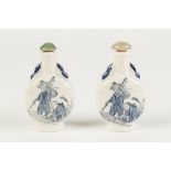 TWO IDENTICAL MODERN CHINESE POTTERY SNUFF BOTTLES, decorated with figures in blue