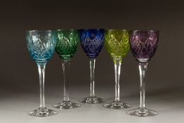 SUITE OF FIVE LORRAINE CRYSTAL CUT GLASS WINE GLASSES, the bowls with harlequin flashed colours