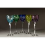 SUITE OF FIVE LORRAINE CRYSTAL CUT GLASS WINE GLASSES, the bowls with harlequin flashed colours