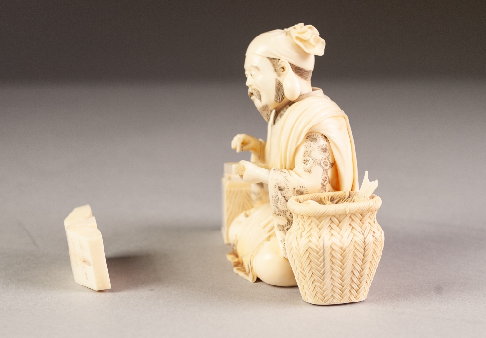 JAPANESE MEIJI PERIOD CARVED SECTIONAL IVORY OKIMONO OF A STREET VENDOR, modelled seated with a - Image 4 of 6