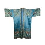 A CHINESE EMBROIDERED SILK COVERLETTE worked in colourful silks with predominately pink flowers on a