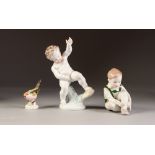 HEREND PORCELAIN FIGURE OF A CHERUB, together with A HUNGARIAN PORCELIAN FIGURE OF A SEATED CHILD