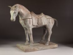 AN INTERESTING CHINESE TANG DYNASTY STYLE CAST BRONZE SADDLED HORSE, ON A RECTANGULAR PLINTH BASE,