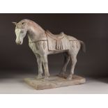 AN INTERESTING CHINESE TANG DYNASTY STYLE CAST BRONZE SADDLED HORSE, ON A RECTANGULAR PLINTH BASE,